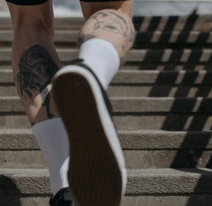 Action shot of legs during a dynamic cardio movement.