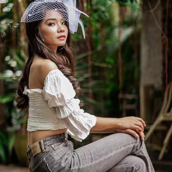 Close-up of a person's hands in a calm, focused pose.